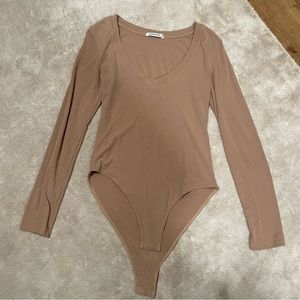 Women’s long sleeve tan v neck body suit